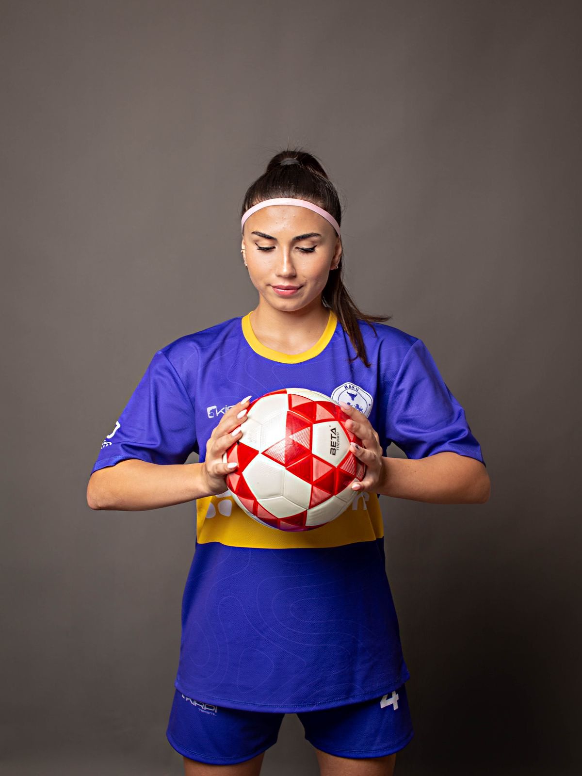 Baku Juniors player Fidan posing with football